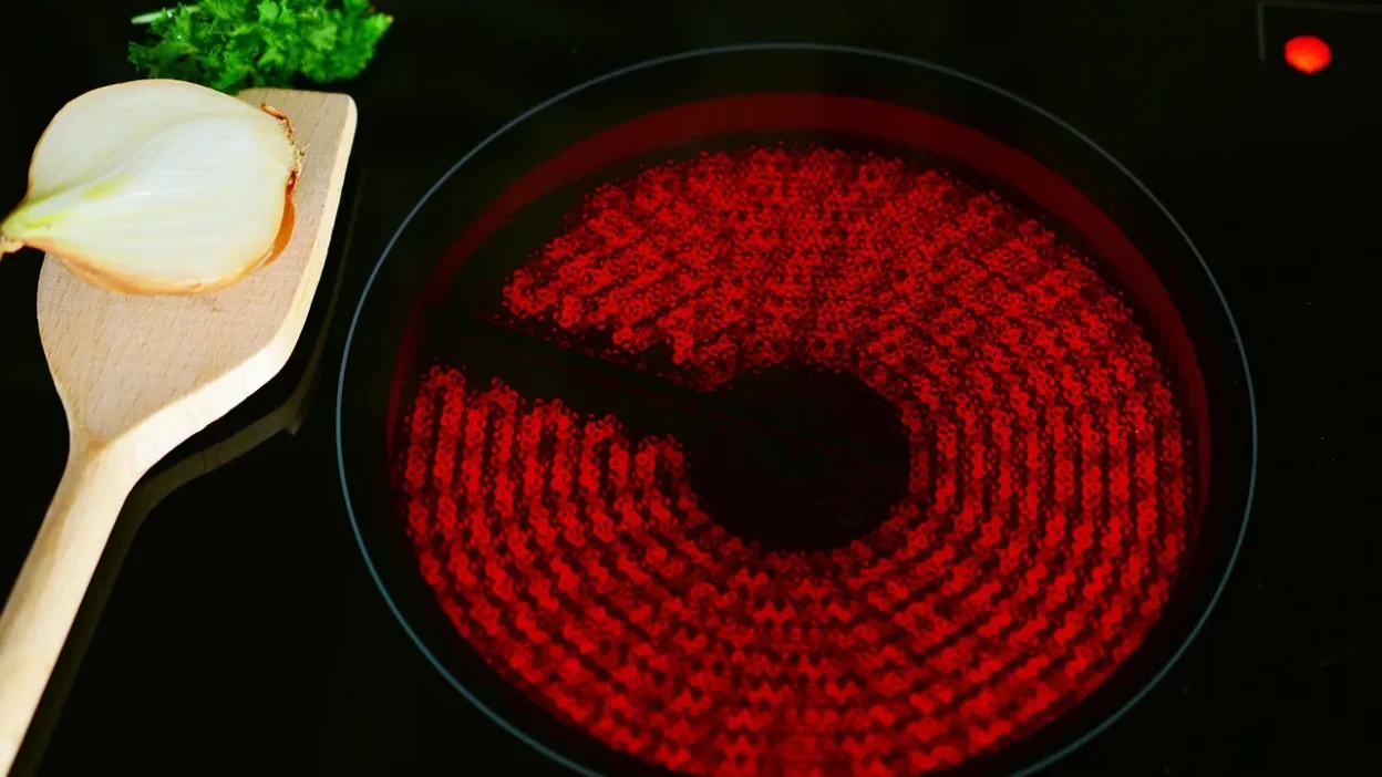 Stylish kitchen shelves decorated with ceramic vases, glass jars, and wooden bowls for a modern rustic look.