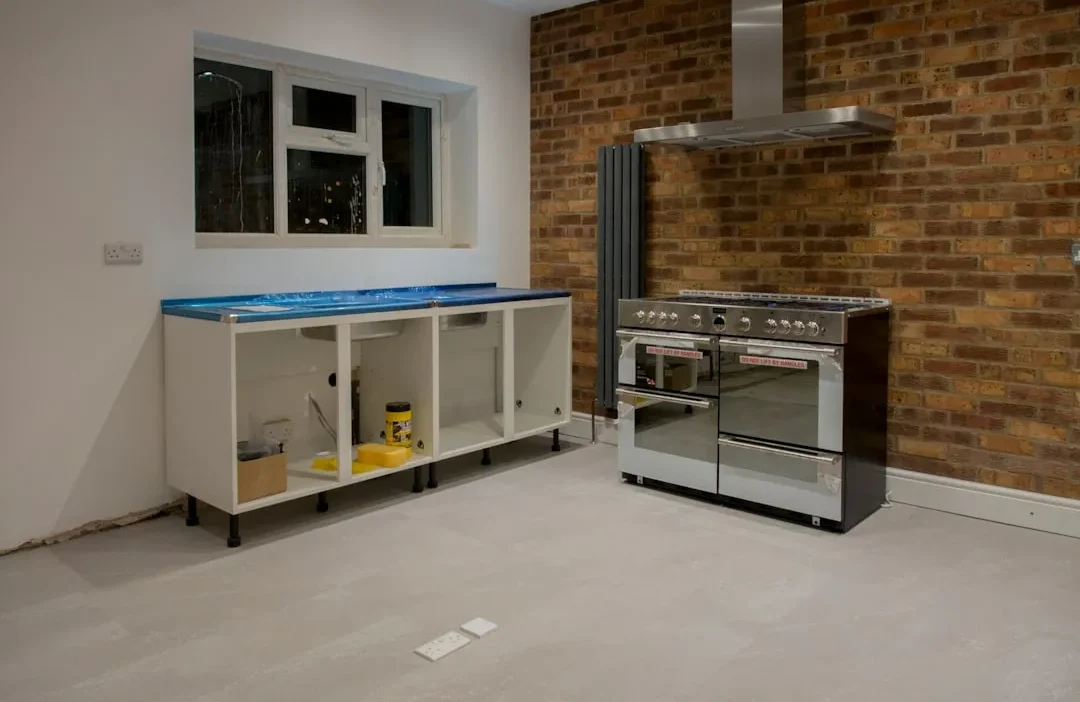 Modern kitchen with sage green walls and white subway tile backsplash refresh