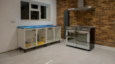 Modern kitchen with sage green walls and white subway tile backsplash refresh
