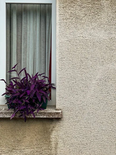 Kitchen Windowsill With Plants And Textured Towels