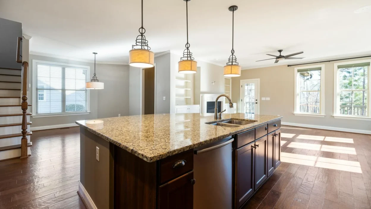 A bright, well-lit modern kitchen with layered lighting under cabinets and on the ceiling.