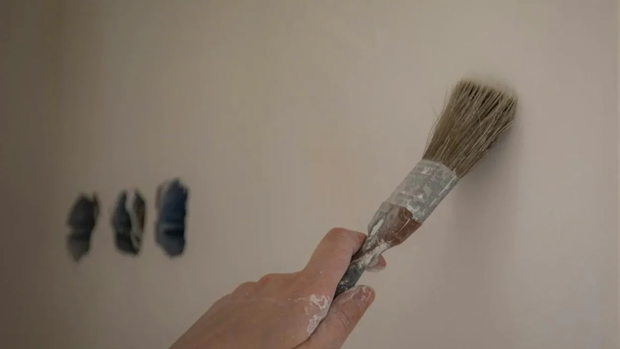 Kitchen paint color comparison showing how it changes from artificial light to natural daylight