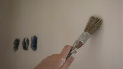 Kitchen paint color comparison showing how it changes from artificial light to natural daylight